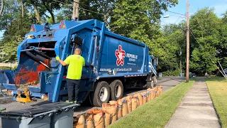 Repainted EZ-Pack rear loader garbage truck packing heavy yard waste bag lines!