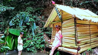 two girls build a camp using materials from tropical banana trees (@pinkshirtgirl )