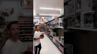 white kid throws football across WalMart