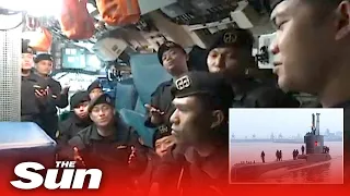 Haunting last footage of Indonesia sub crew seen singing weeks before all 53 died