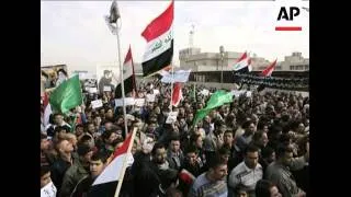 Iraqis took to the streets on Monday to demand the release of a reporter who threw his shoes at Pres