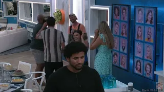 Houseguests look at memory wall photos, talk about the comps