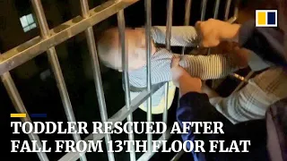 Two-year-old in China rescued by neighbours after falling from 13th-floor window