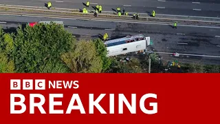 M53 crash: Teen girl and driver killed after school bus overturns in UK - BBC News
