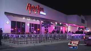 2 killed, 2 arrested in shooting outside sports bar