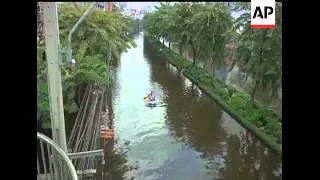 Parts of Thailand's flood-threatened capital are rapidly emptying of residents who are listening to