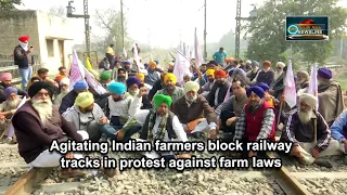 Agitating Indian farmers block railway tracks in protest against farm laws