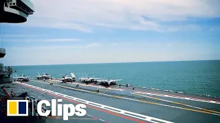 A rare at-sea look at China’s aircraft carrier the Liaoning and fighter jet training