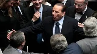 Berlusconi scrapes through confidence vote