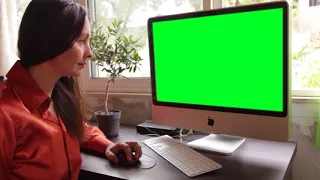 Woman Using Computer With Green Screen Display  Free stock footage  By Nelson Noman