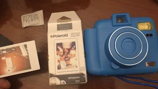 Blue Sharper Image instant camera PIF300 Film battery and film insertion