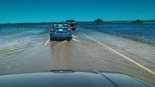 Flooded highway driving in Saskatchewan Canada - 1084457