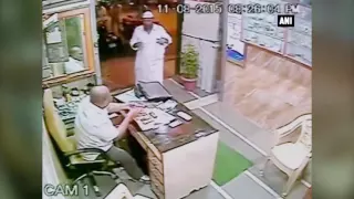 CCTV footage - A customer saves physically challenged Mumbai shopkeeper from sword attack