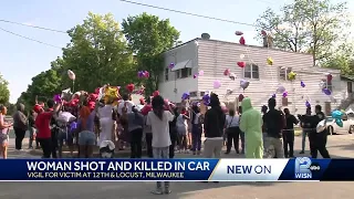 Vigil held for woman shot, killed in car