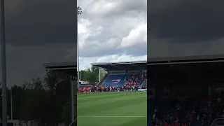 Oldham fans run on pitch as one fan pushes over chesterfield goalkeeper