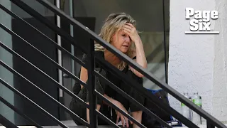 Heather Locklear appears distressed, bizarrely walks on ledge of office building