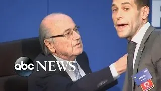 Security Reacts Quickly as FIFA's Sepp Blatter Approached by Demonstrator