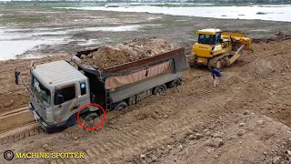 Incredible bulldozer use powerful to pull recovery dump truck stuck deep wet soil ឡានជាប់ផុង