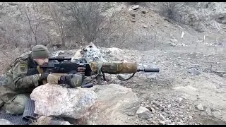 Ukrainian soldier using a modified version of Maxim machine gun