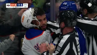 Evander Kane comes after Jake McCabe during a scrum between the Oilers and Maple Leafs