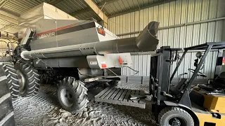 Showing how to put the straw spreader back on the Gleaner R72.