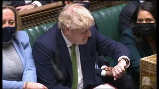 Boris Johnson laughs and checks his watch as Ian Blackford demands resignation