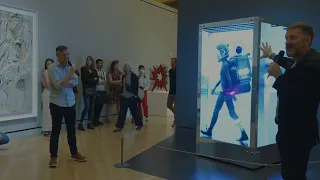 Beeple performs a live update of HUMAN ONE for the first time in front of a crowd at Crystal Bridges