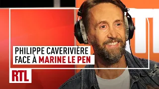 Philippe Caverivière, et son chat, face à Marine Le Pen