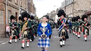 Drum Majors flourish during Huntly Pipe Band's 70th anniversary parade , Scotland, Sept' 2018