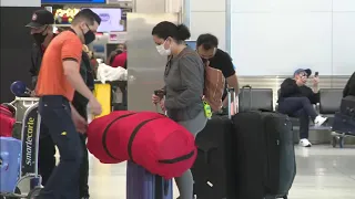 Air travelers at Miami International Airport react to CDC’s new coronavirus testing guidelines