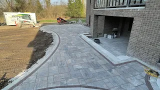 Laying down UNILOCK pavers!!