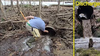 Unclogging And Sending Log Through Old Iron Culvert