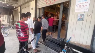 Desperate Palestinians queue for bread at bakery in Gaza City amid famine warning