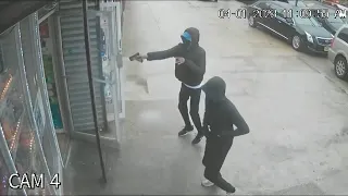 Video shows gunman firing shots into Philadelphia store