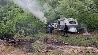 WE WERE CAUGHT IN THE RAIN IN A HIDDEN STREAM IN THE FOREST