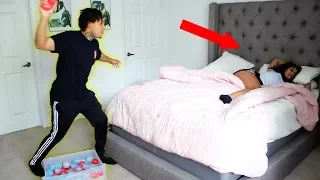 THROWING WATER BALLOONS AT SLEEPING GIRLFRIEND PRANK!!