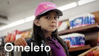 A young girl and her grandpa try to win a bike in a grocery store sweepstakes. | Manufactured Luck