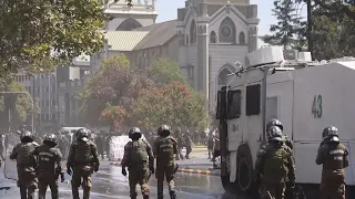 Students clash with police during Santiago protest