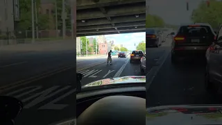 Guy dancing in the middle of traffic at rush hour
