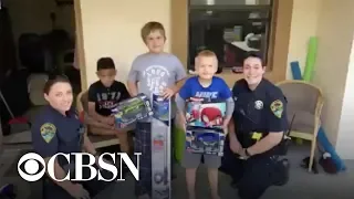 Police officers buy presents for family in need