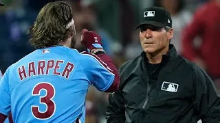 Phillies' Bryce Harper throws batting helmet into stands after ejection.