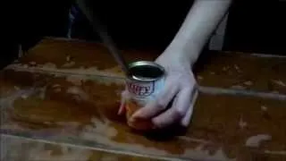 open a can using a knife