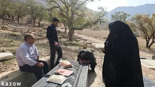 Crying on his father's grave