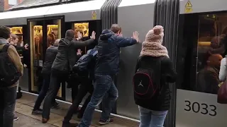 Passengers push stuck tram in Manchester