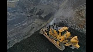 Cat D10T2 & Komatsu D375 pushing off a highwall in Iceland