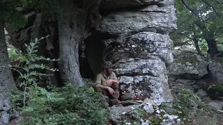 bushcraft in a natural shelter  on the mountain with my puppy, primitive fire, cooking meat etc.