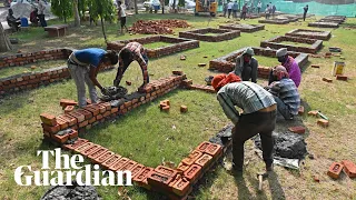 Crematoriums in Delhi forced to build makeshift pyres as India's Covid crisis intensifies