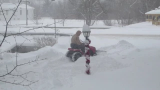 Slamming 2 ft of snow with a lawn tractor without tire chains