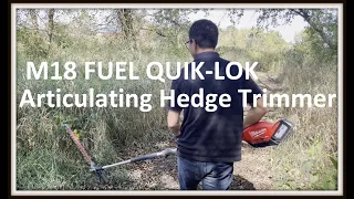 Milwaukee M18 FUEL QUIK-LOK Articulating Hedge Trimmer cutting back tall grasses on trail