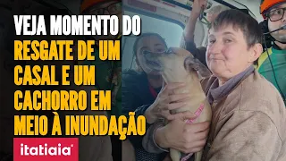 CHUVAS RS: IMAGENS MOSTRAM RESGATE DE UM CASAL E UM CACHORRO EM MEIO À INUNDAÇÃO